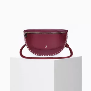 Bandolera de cuero mujer modelo smile clou en color granate, diseño francés exclusivo disponible en Unike, boutique en Pamplona.